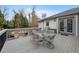 Relaxing backyard deck with outdoor furniture and stone fire pit great for entertaining at 8155 W Tennessee Dr, Lakewood, CO 80226