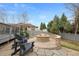 Backyard stone fire pit with Adirondack chairs, perfect for Gathering time and entertaining at 8155 W Tennessee Dr, Lakewood, CO 80226