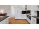 Updated kitchen features stainless appliances and custom cabinets at 8155 W Tennessee Dr, Lakewood, CO 80226