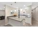 Modern kitchen with sleek white cabinets, gray countertops, pendant lighting, and stainless steel appliances at 8155 W Tennessee Dr, Lakewood, CO 80226