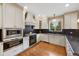Gourmet kitchen features granite counters and stainless steel appliances at 8155 W Tennessee Dr, Lakewood, CO 80226