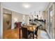 Open kitchen featuring wood floors, stainless appliances and breakfast bar at 8155 W Tennessee Dr, Lakewood, CO 80226