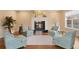 Bright living room features a fireplace, hardwood floors, and comfortable seating area at 8155 W Tennessee Dr, Lakewood, CO 80226