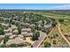 Aerial view of a neighborhood with mature trees at 13990 E Chenango Dr, Aurora, CO 80015