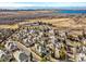 Community aerial view featuring mature landscaping, lake and mountain views at 13990 E Chenango Dr, Aurora, CO 80015