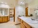 Bright bathroom with vanity, lots of counterspace, and a soaking tub at 13990 E Chenango Dr, Aurora, CO 80015