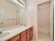 Bathroom featuring a double sink vanity and shower/tub at 13990 E Chenango Dr, Aurora, CO 80015