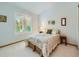 Light-filled bedroom with vaulted ceiling and window at 13990 E Chenango Dr, Aurora, CO 80015