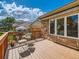 Spacious deck with seating area and views of neighboring houses at 13990 E Chenango Dr, Aurora, CO 80015