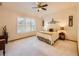 Bright bedroom features large windows, vaulted ceilings, and modern decor at 13990 E Chenango Dr, Aurora, CO 80015