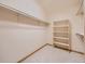 Organized walk-in closet with shelving and hanging racks at 13990 E Chenango Dr, Aurora, CO 80015