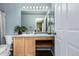 Bathroom features large vanity, mirror and shelf at 3940 Malaya St, Denver, CO 80249