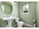The half bathroom has fresh paint and a modern sink at 3940 Malaya St, Denver, CO 80249