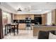 Charming eat-in kitchen with stainless steel appliances, black countertops, and ample natural light for a cozy feel at 3940 Malaya St, Denver, CO 80249