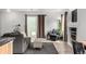 Bright living room with sliding glass doors to the patio at 3940 Malaya St, Denver, CO 80249