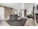 Living room features neutral paint, decorative rug and back patio access at 3940 Malaya St, Denver, CO 80249