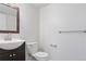 Bathroom featuring a sink, a toilet, and wall-mounted towel racks at 11912 Madison Pl, Thornton, CO 80223