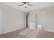 Neutral bedroom with carpet, ceiling fan, and natural light at 11912 Madison Pl, Thornton, CO 80223