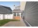 Inviting two-story townhouse features a two-car garage, manicured lawn, and ample driveway at 11912 Madison Pl, Thornton, CO 80223