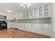 Bright kitchen features white cabinets, granite countertops, and stainless steel appliances at 11912 Madison Pl, Thornton, CO 80223