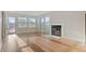 Spacious living room boasts hardwood floors and a cozy fireplace at 11912 Madison Pl, Thornton, CO 80223