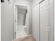 Hall view of bathroom with subway tile, shower and closet at 18672 E Chaffee Pl, Denver, CO 80249