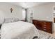 Bedroom features include wood-look flooring, closet, neutral walls, and ample natural light at 18672 E Chaffee Pl, Denver, CO 80249