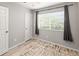 Bedroom with a ceiling fan, window and door at 18672 E Chaffee Pl, Denver, CO 80249