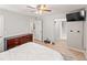 Spacious bedroom with wood-look floors, recessed lights, ceiling fan, and en-suite bathroom at 18672 E Chaffee Pl, Denver, CO 80249