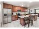 Stylish kitchen equipped with granite countertops, stainless steel appliances, and wooden cabinetry at 18672 E Chaffee Pl, Denver, CO 80249