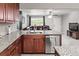 Modern kitchen with a large island, stainless steel appliances, and an open layout at 18672 E Chaffee Pl, Denver, CO 80249