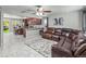 Open-concept living space showcasing kitchen, living area, and bright, natural light at 18672 E Chaffee Pl, Denver, CO 80249