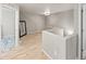 Bright open loft with wood-look floors and neutral color palette with several doorways at 18672 E Chaffee Pl, Denver, CO 80249