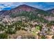 Scenic aerial view of the landscape with a picturesque mountain view and residential neighborhood at 459 Virginia Ave, Palmer Lake, CO 80133