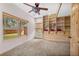 Bright bedroom with carpet, built-in shelving, ceiling fan, and natural light at 459 Virginia Ave, Palmer Lake, CO 80133
