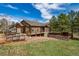 Well-maintained home showcasing a spacious garage and beautiful landscaping, creating a welcoming and attractive curb appeal at 459 Virginia Ave, Palmer Lake, CO 80133