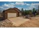 Charming single-story home with a two-car garage, stone accents, and a private driveway at 459 Virginia Ave, Palmer Lake, CO 80133