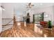 Spacious living room with vaulted ceilings, hardwood floors, fireplace, and sliding doors to the deck at 459 Virginia Ave, Palmer Lake, CO 80133