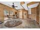 Recreation room featuring tiled flooring, wood-paneled walls, and a bar table at 459 Virginia Ave, Palmer Lake, CO 80133