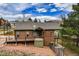 Exterior view of home with landscaping, deck and garage at 459 Virginia Ave, Palmer Lake, CO 80133