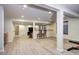 Finished basement with neutral walls, flooring, and built in bar area at 15160 W Iliff Pl, Lakewood, CO 80228