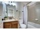 Cozy bathroom with a vanity, and a shower-tub combo perfect for a guest bathroom at 15160 W Iliff Pl, Lakewood, CO 80228