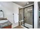 Modern bathroom with a glass-enclosed shower, vanity with granite countertop, and neutral tones at 15160 W Iliff Pl, Lakewood, CO 80228