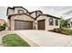 Charming home featuring a stone facade and two-car garage plus separate one car garage, creating great curb appeal at 15160 W Iliff Pl, Lakewood, CO 80228