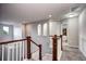 Upstairs hallway with modern trim, recessed lighting, and neutral paint, leading to multiple rooms at 15160 W Iliff Pl, Lakewood, CO 80228