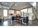 Elegant kitchen with white cabinets, stainless steel appliances, and a large island with bar seating at 15160 W Iliff Pl, Lakewood, CO 80228