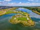 Beautiful aerial view of community lake with walking trails and green space on a sunny day at 5128 Preserve Pl, Firestone, CO 80504