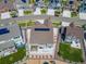 This aerial view showcases a home with solar panels, a spacious backyard, and a fenced perimeter at 5128 Preserve Pl, Firestone, CO 80504
