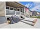 This home features a raised patio, a grill, and a view of the fenced backyard at 5128 Preserve Pl, Firestone, CO 80504