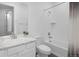 Bright bathroom featuring one sink, tub with shower, and ceramic tile flooring at 5128 Preserve Pl, Firestone, CO 80504